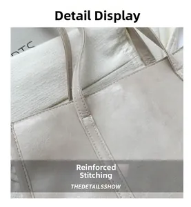 Detailed close-up showing reinforced stitching on the beige leather tote bag handle