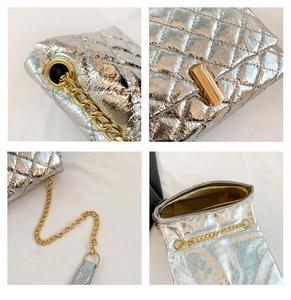 Detail of silver quilted chain bag with gold metal hardware and turn-lock closure