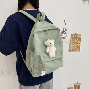 Minimalist mint green nylon backpack with large capacity and cute plush bear charm
