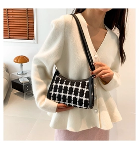 Fashionable black and white plaid tweed shoulder bag with elegant leather trim and strap