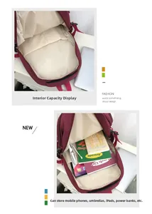 Détail de l'intérieur du sac à dos bordeaux montrant le compartiment principal et la capacité