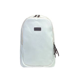 Minimalist white student backpack with dark brown brand patch and leather pullers