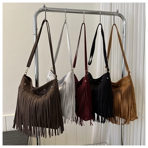 Detailed display of vintage hobo bags with long tassels and suede finish in five colors