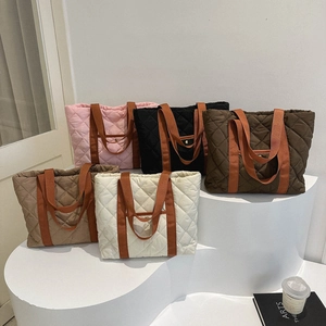 Five colors of large quilted oxford tote bags with stylish diamond stitching and webbing straps