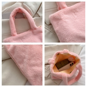 Detail view of pink plush handbag showing soft faux fur texture and spacious inner lining