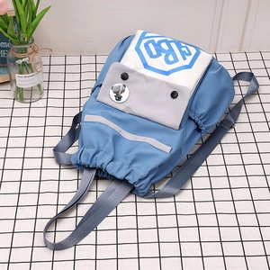 Detail of blue drawstring nylon backpack with contrast top and grey reflective safety strip