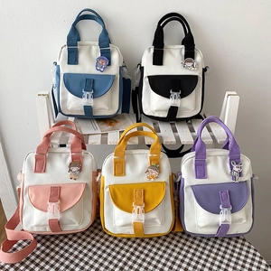 Multi-color canvas crossbody bags for women in blue, pink, and yellow with cartoon pins