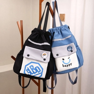 Close-up of color-block nylon bucket bags featuring drawstring closure and badge details
