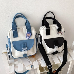 Korean canvas crossbody bag in blue and black patchwork style with cartoon badges