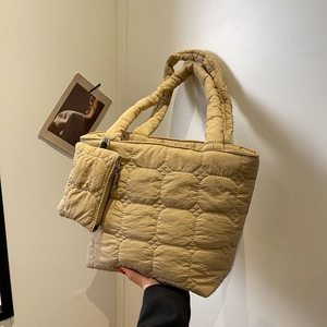 Padded quilted tote bag with matching coin purse in warm earth tones and soft fabric