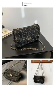 Close-up detail of black tweed chain crossbody bag with golden metal rotary lock