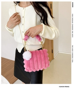 Pink plush crossbody bag with striped faux fur texture and a white pompom detail