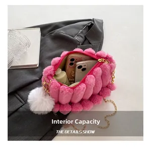 Pink plush handbag detail showing internal capacity for phones and cosmetics with chain