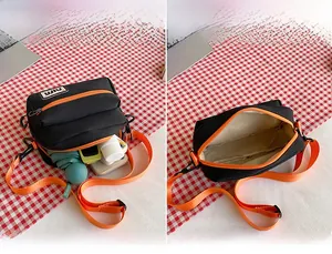Detail view of the black canvas bag showing interior capacity for phone and accessories