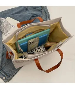 Interior view of large canvas tote bag showing spacious storage for daily items