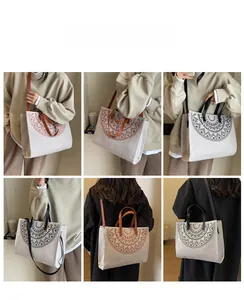 Ethnic canvas tote bag with bohemian radial patterns in brown and black styles