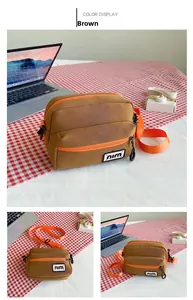Brown canvas crossbody bag featuring orange zipper detail and adjustable strap