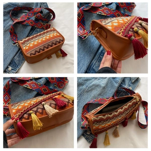 Detail of bohemian shoulder bag featuring colorful geometric strap and multicolor tassels