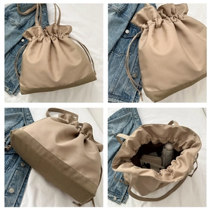 Detailed views of khaki drawstring bucket bag showing interior space and bottom texture