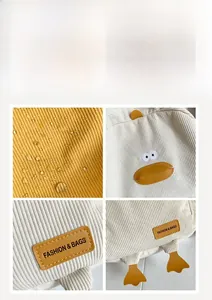 Detail of waterproof corduroy fabric and cute 3D cartoon duck embroidery on the backpack