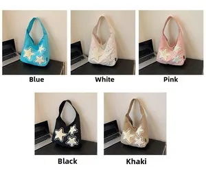Detailed grid view of canvas tote bags with star embroidery in five various colors