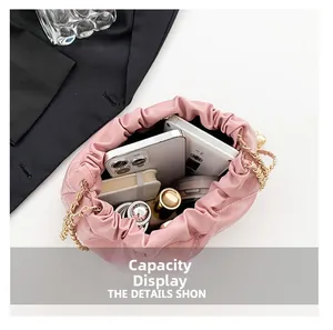 Interior view of pink quilted bucket bag showing capacity for phone and cosmetics