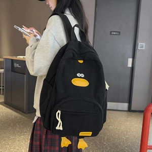Black corduroy backpack with cute cartoon duck design for students and casual travel