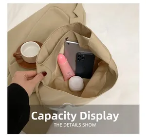 Top view of large capacity khaki canvas tote bag showing interior space and daily essentials