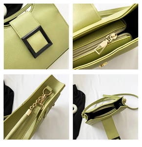 Detail view of light green lychee textured crossbody bag with square buckle and gold hardware