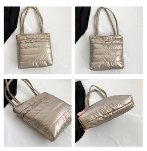 Detail of champagne gold quilted tote bag with parallel stitching and padded texture