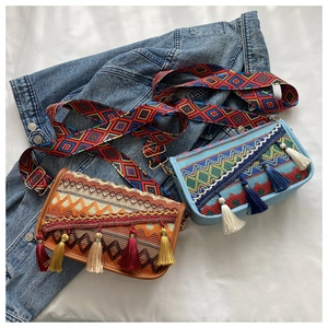 Detail of bohemian crossbody bags featuring intricate woven patterns and colorful tassels