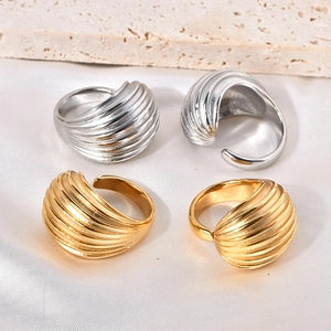 Elegant gold and silver croissant style adjustable textured rings on premium background
