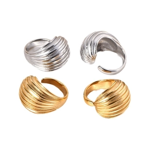 Minimalist gold and silver rings with seashell texture and adjustable open bands