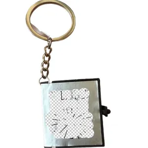 Mini Bible cross keychain pendant with silver cover and holy light engraving detail