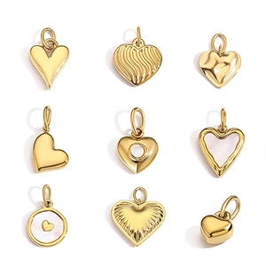 Set of 9 assorted 14K gold-plated heart and round pendants in a minimalist jewelry collection