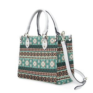 Detail view of Aztec geometric pattern on white tote bag with removable shoulder strap