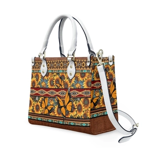 Detail of sunflower and butterfly print on tote bag with bohemian geometric borders
