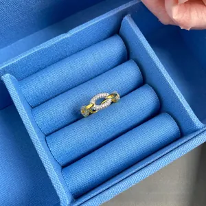 Detailed close-up of a luxury gold and silver chain ring with pavé-set zircon crystals