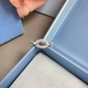 Detailed close-up of a silver chain ring with pave set oval diamond focal point