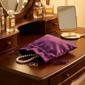 Purple satin drawstring pouch for luxury jewelry storage and elegant gift packaging