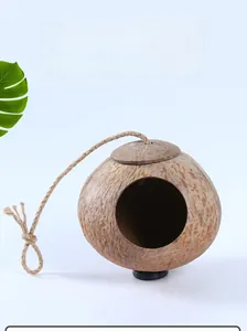 Natural coconut shell bird nest with hanging rope for parrots and small pets