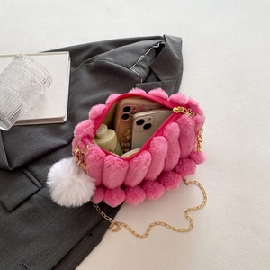 Pink plush women's shoulder bag with gold chain strap and decorative pompom charm