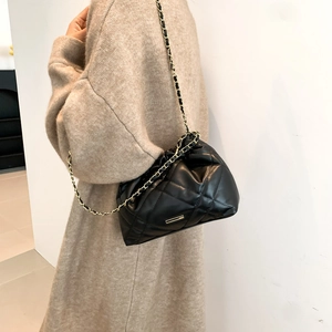 Quilted black leather crossbody bag with elegant gold chain and rhombus pattern