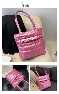 Close-up of pink quilted puffer tote bag with metallic finish and horizontal stitching