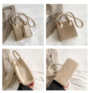 Detail view of khaki faux fur tote bag with matching mini pouch and leather strap