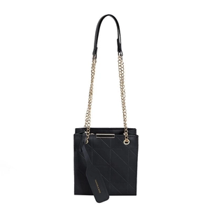 Classic black quilted leather crossbody bag with golden chain strap and brand tag