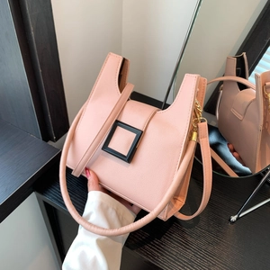 Pink minimalist crossbody square bag with black buckle and detachable strap