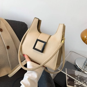Minimalist beige crossbody bag with lychee texture leather and black square buckle