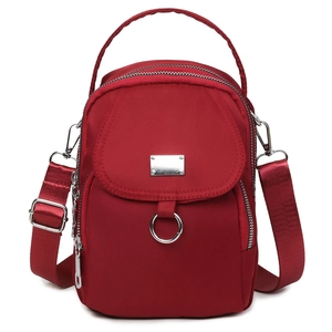 Waterproof red nylon mini crossbody bag with multi-layer zippers and silver hardware