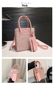 Detail of pink faux fur tote bag with matching leather pouch and gold-tone hardware